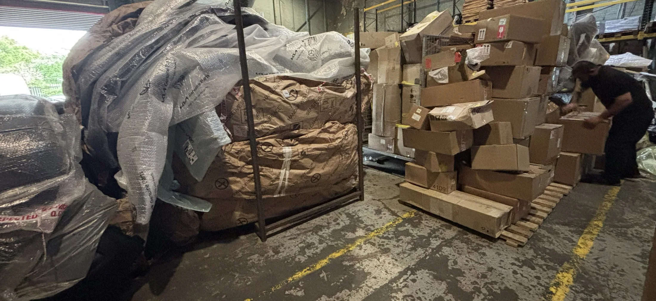 Boxed unused genuine car parts awaiting a redundant stock buy-back